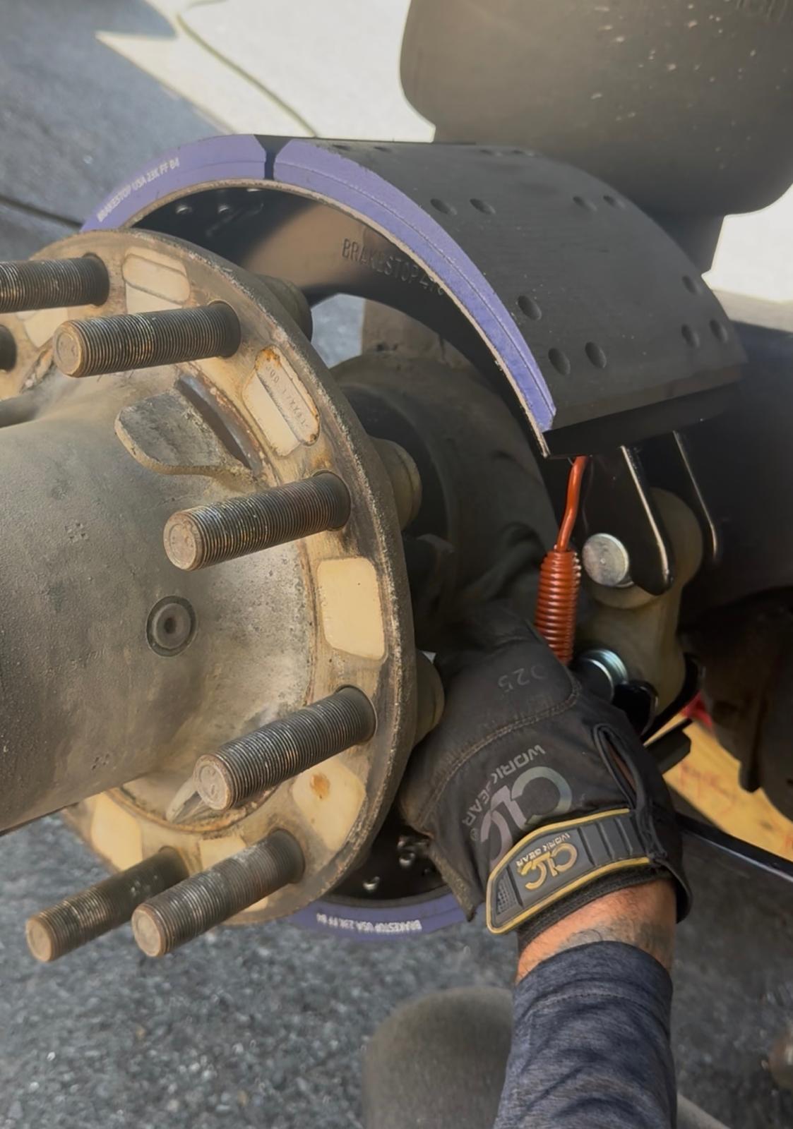 Truck mechanic inspecting commercial vehicle Austin TX