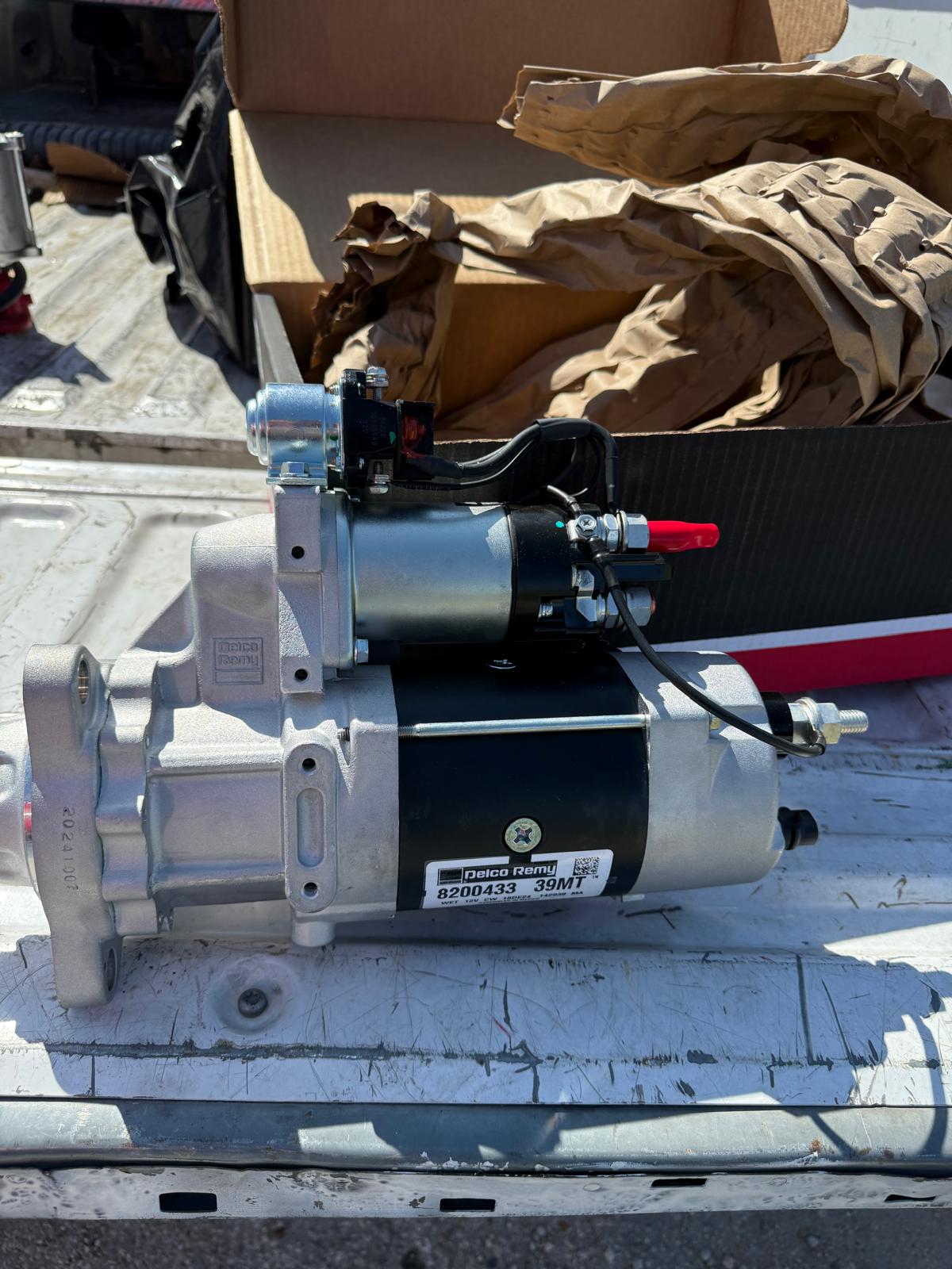 Starter motor replacement on diesel truck engine roadside service